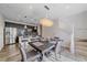Bright dining area featuring an open kitchen with stainless steel appliances and a modern chandelier at 21392 E Stroll Ave, Parker, CO 80138
