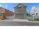 Charming two-story home with a well-maintained garage and landscaped front yard at 21392 E Stroll Ave, Parker, CO 80138