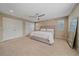 Spacious primary bedroom with ample natural light, ceiling fan, and a walk-in closet at 21392 E Stroll Ave, Parker, CO 80138
