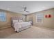 Spacious primary bedroom with ample natural light and a ceiling fan at 21392 E Stroll Ave, Parker, CO 80138