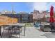 Private backyard with patio, dining area, seating, and modern climbing wall feature at 4454 Utica St, Denver, CO 80212