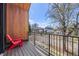 Private balcony with neighborhood views, iron railing, and wood trim at 4454 Utica St, Denver, CO 80212