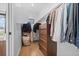 Functional walk-in closet with wood floors, sleek built-in shelving, and ample storage solutions to maximize organization at 4454 Utica St, Denver, CO 80212