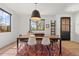 Elegant dining area featuring modern lighting, stylish furnishings, and hardwood floors at 4454 Utica St, Denver, CO 80212