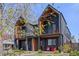 Modern black townhome with balconies and striking architectural details and lovely landscaping at 4454 Utica St, Denver, CO 80212