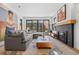 Cozy living room with stylish decor, fireplace, and sliding glass doors to the backyard at 4454 Utica St, Denver, CO 80212