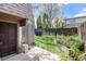 Backyard featuring mature trees, garden beds, a privacy fence, and a convenient shed at 9349 E Chenango Ave, Greenwood Village, CO 80111