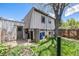 Cozy backyard featuring a well-maintained lawn and partial view of the home's architecture at 9349 E Chenango Ave, Greenwood Village, CO 80111