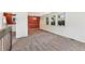Open floor plan featuring a dining area, carpeted living space, and multiple windows at 9349 E Chenango Ave, Greenwood Village, CO 80111