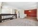 Open floor plan featuring a dining area, carpeted living space, and staircase at 9349 E Chenango Ave, Greenwood Village, CO 80111