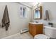 This functional bathroom is equipped with a mirrored vanity, and neutral tiling for a clean look at 176 W Elm St, Elizabeth, CO 80107