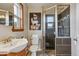 Bathroom featuring a shower stall and a nice vanity with modern fixtures at 176 W Elm St, Elizabeth, CO 80107
