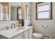 Bathroom featuring a large mirror, modern vanity, and framed art work at 176 W Elm St, Elizabeth, CO 80107