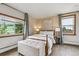 Bedroom with neutral tones, lots of natural light, and a comfortable bed at 176 W Elm St, Elizabeth, CO 80107