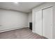 Bedroom with built in closet and heater and neutral carpet and paint at 176 W Elm St, Elizabeth, CO 80107