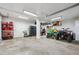 The expansive garage offers plenty of space for vehicles and equipment, perfect for hobbyists or car enthusiasts at 176 W Elm St, Elizabeth, CO 80107