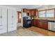 Well-appointed kitchen with dark wood cabinets, updated appliances, and spacious countertops at 176 W Elm St, Elizabeth, CO 80107