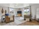 The living room is brightened by large windows and features stylish, comfortable seating for relaxation at 176 W Elm St, Elizabeth, CO 80107