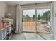View of the deck with rocking chairs from inside a room with nice lighting at 176 W Elm St, Elizabeth, CO 80107