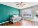 Comfortable bedroom featuring hardwood floors, bright window, and great natural light at 2161 S Genoa St, Aurora, CO 80013