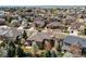 Stunning aerial view showcasing a home nestled in a picturesque neighborhood with mature trees and manicured lawns at 13970 Craig Way, Broomfield, CO 80020