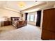 This bedroom offers a trey ceiling, natural light, and a comfortable, inviting atmosphere at 13970 Craig Way, Broomfield, CO 80020