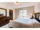 This bedroom features a walk-in closet, neutral decor, and a cozy, comfortable ambiance at 13970 Craig Way, Broomfield, CO 80020