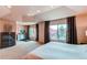 This bedroom includes lots of natural light from the large windows and neutral walls and carpeting at 13970 Craig Way, Broomfield, CO 80020