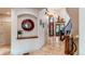 Welcoming entryway with arched doorways, unique decor, and a glimpse of the stunning staircase at 13970 Craig Way, Broomfield, CO 80020