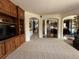 Open living room with dark wood cabinets, recessed lights, and direct access to the kitchen at 13970 Craig Way, Broomfield, CO 80020