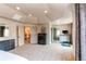 Expansive main bedroom with dark wood furniture, recessed lighting, and multiple entrances at 13970 Craig Way, Broomfield, CO 80020