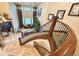A top-down view of the staircase and grand foyer, featuring large windows and plenty of natural light at 13970 Craig Way, Broomfield, CO 80020