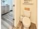 Clean and functional bathroom features wood-look flooring and modern fixtures at 4060 N Rome St, Aurora, CO 80019