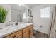 Bright bathroom with granite countertop, vanity, modern fixtures, and wood-style flooring at 4060 N Rome St, Aurora, CO 80019