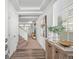 Inviting entryway featuring wood floors, a staircase, and elegant decor, creating a warm and welcoming ambiance at 4060 N Rome St, Aurora, CO 80019