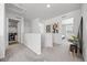 Open hallway featuring modern decor, plush carpet, and easy access to bedrooms and laundry at 4060 N Rome St, Aurora, CO 80019