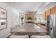 Bright kitchen features wood cabinets, stainless steel appliances, granite countertops, and hardwood style floors at 4060 N Rome St, Aurora, CO 80019