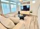 Cozy living room with contemporary furnishings, a large window, and a modern entertainment center at 4060 N Rome St, Aurora, CO 80019