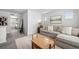 Inviting living room with gray sofa, decorative pillows, plush rug, and cozy ambiance at 4060 N Rome St, Aurora, CO 80019