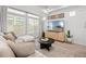 Bright and airy living room featuring a large window, comfortable seating, and stylish decor for a relaxing atmosphere at 4060 N Rome St, Aurora, CO 80019