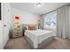 Comfortable main bedroom with large window, neutral decor, and soft carpet at 4060 N Rome St, Aurora, CO 80019