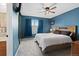 Charming bedroom with a sliding door closet, window, and neutral color palette at 9816 Garwood St, Littleton, CO 80125