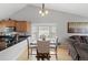 Kitchen and dining area featuring a dining table and living room furniture at 9816 Garwood St, Littleton, CO 80125