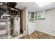 Basement with a laundry area that includes a washer, dryer, and storage shelves at 9816 Garwood St, Littleton, CO 80125