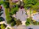An aerial view of a home showcases the backyard layout, patio, and mature landscaping at 2345 Spotswood Pl, Boulder, CO 80304