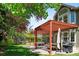Backyard featuring covered patio with outdoor seating, dining table, and grill, perfect for outdoor entertaining at 2345 Spotswood Pl, Boulder, CO 80304