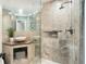 Updated bathroom with a walk-in shower, tiled walls, and a modern vessel sink at 2345 Spotswood Pl, Boulder, CO 80304