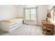 Bright bedroom with arched window, built in bed and desk space, perfect for studying and relaxation at 2345 Spotswood Pl, Boulder, CO 80304