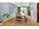 Spacious dining room with modern lighting, a large table, and hardwood flooring at 2345 Spotswood Pl, Boulder, CO 80304