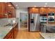 The kitchen has stainless steel appliances and granite counters, leading into a dining area at 2345 Spotswood Pl, Boulder, CO 80304